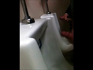 Two Slim Dicks Getting Wanked At The Urinals